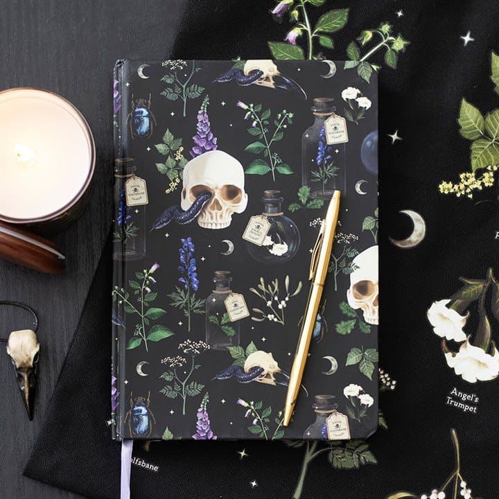 A5 notebook with a gothic design of skulls, serpents and poisonous plants