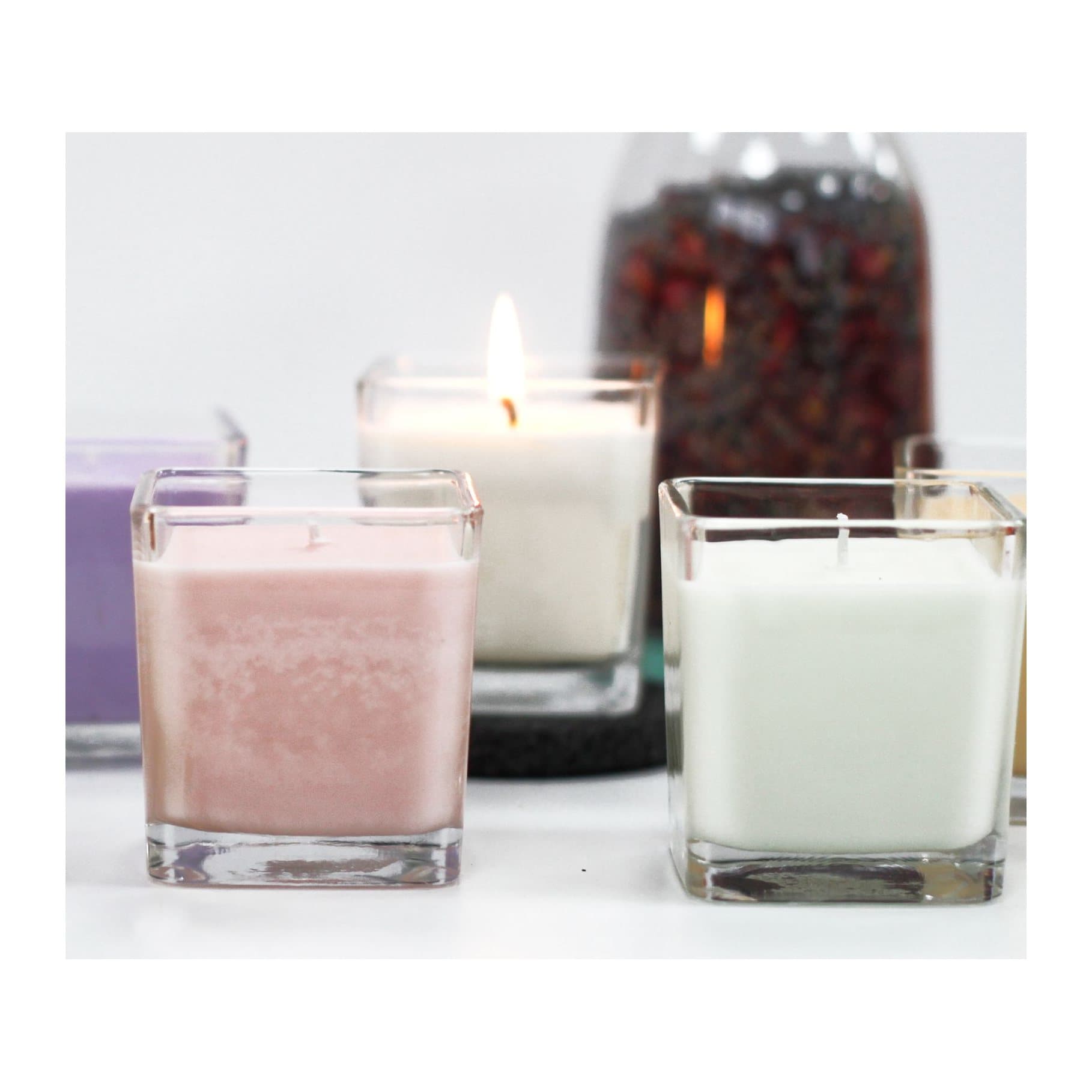 Soy wax candle in a chunky glass jar with no label