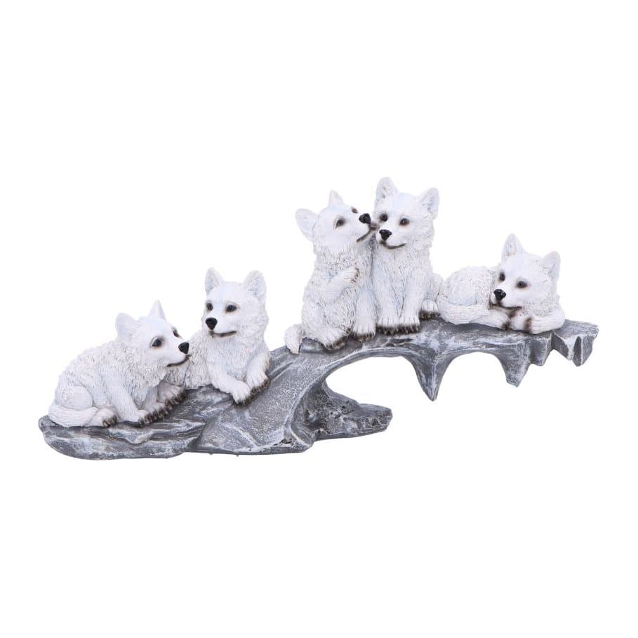 Five white resin wolves arranged in a line