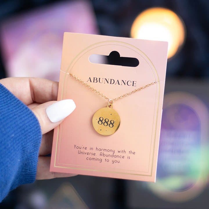 888 angel number necklace in stainless steel on a cardboard back