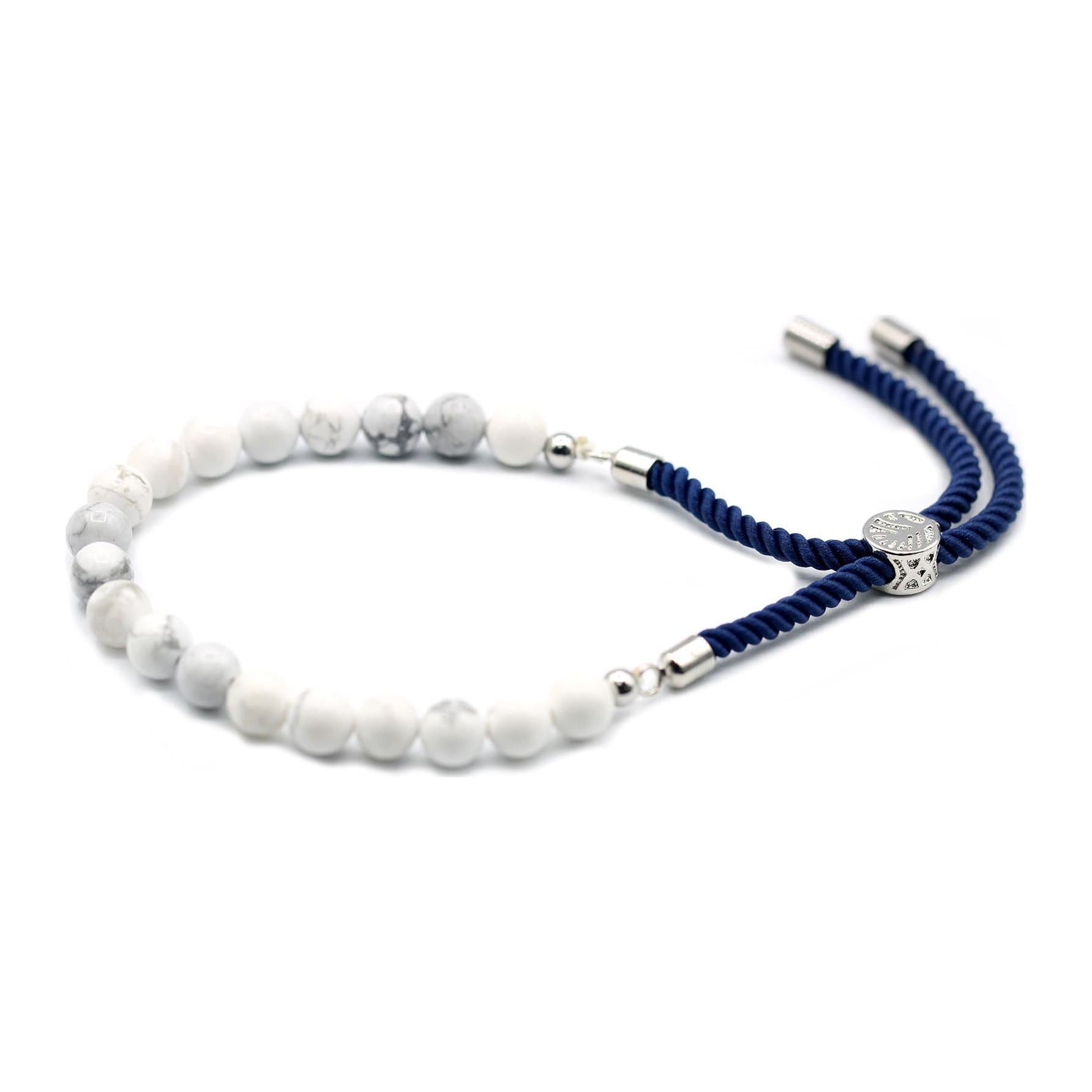 Navy string bracelet with a white howlite gemstone and a silver plated toggle