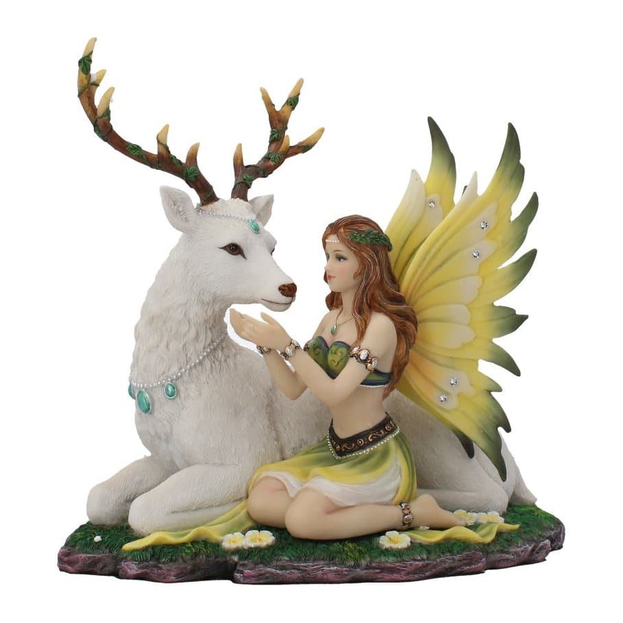 Resin figurine of an auburn-haired fairy and a white hart in a flowered meadow