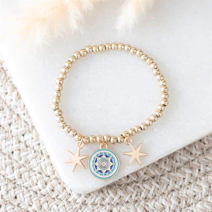 Gold-tone beaded bracelet with an all seeing eye and star charms