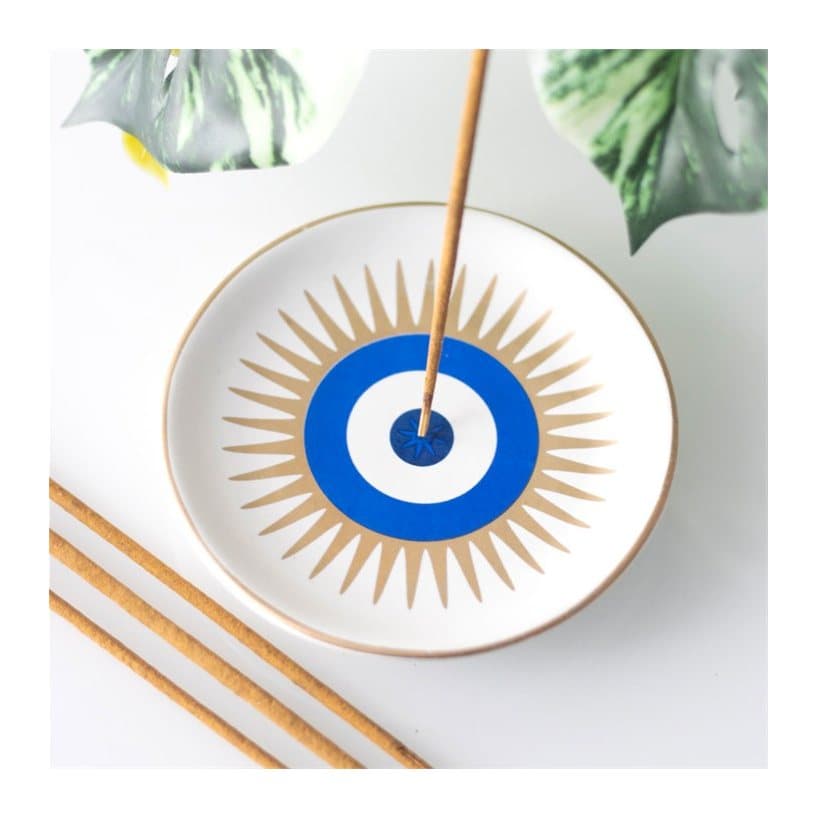 Ceramic incense stick holder shaped like an all-seeing eye