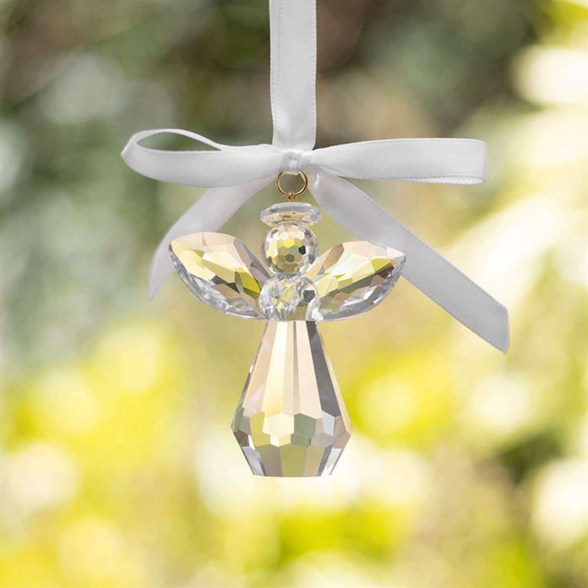 Faceted glass angel decoration with a white ribbon on an Always Beside You card