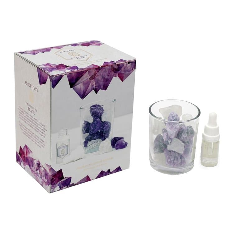 Glass jar of amethyst crystals with fragrance oil