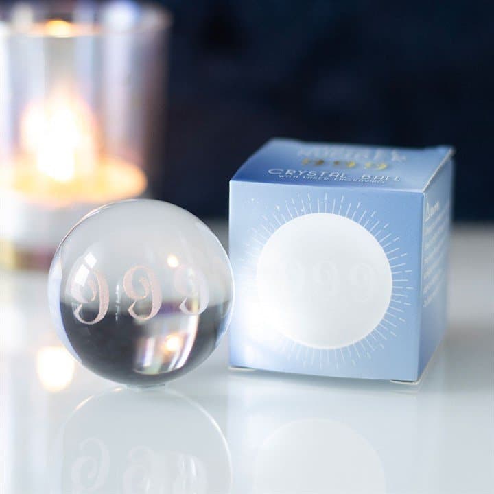 Glass crystal ball with the 999 angel number engraved inside