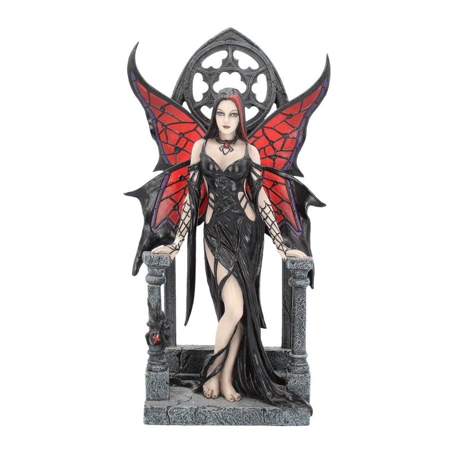 Gothic fairy figurine with black and red spider web wings before a church window