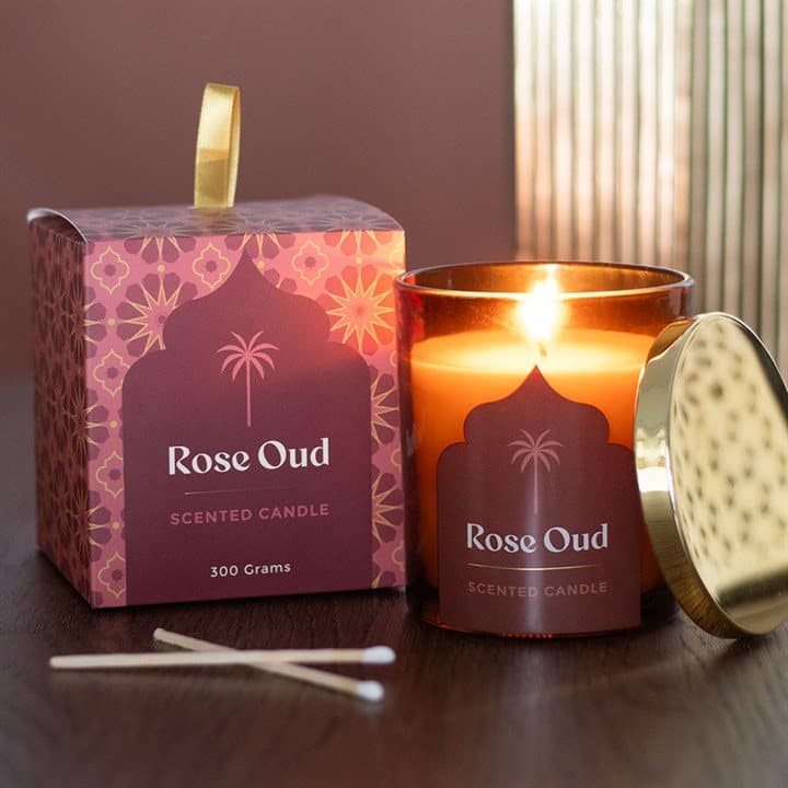Rose oud scented candle in a sleek glass jar with colour cardboard box