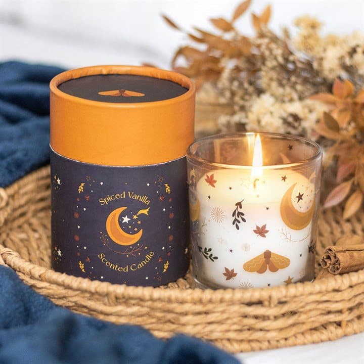 Spiced vanilla candle in a glass jar with an autumnal moon and leaf design