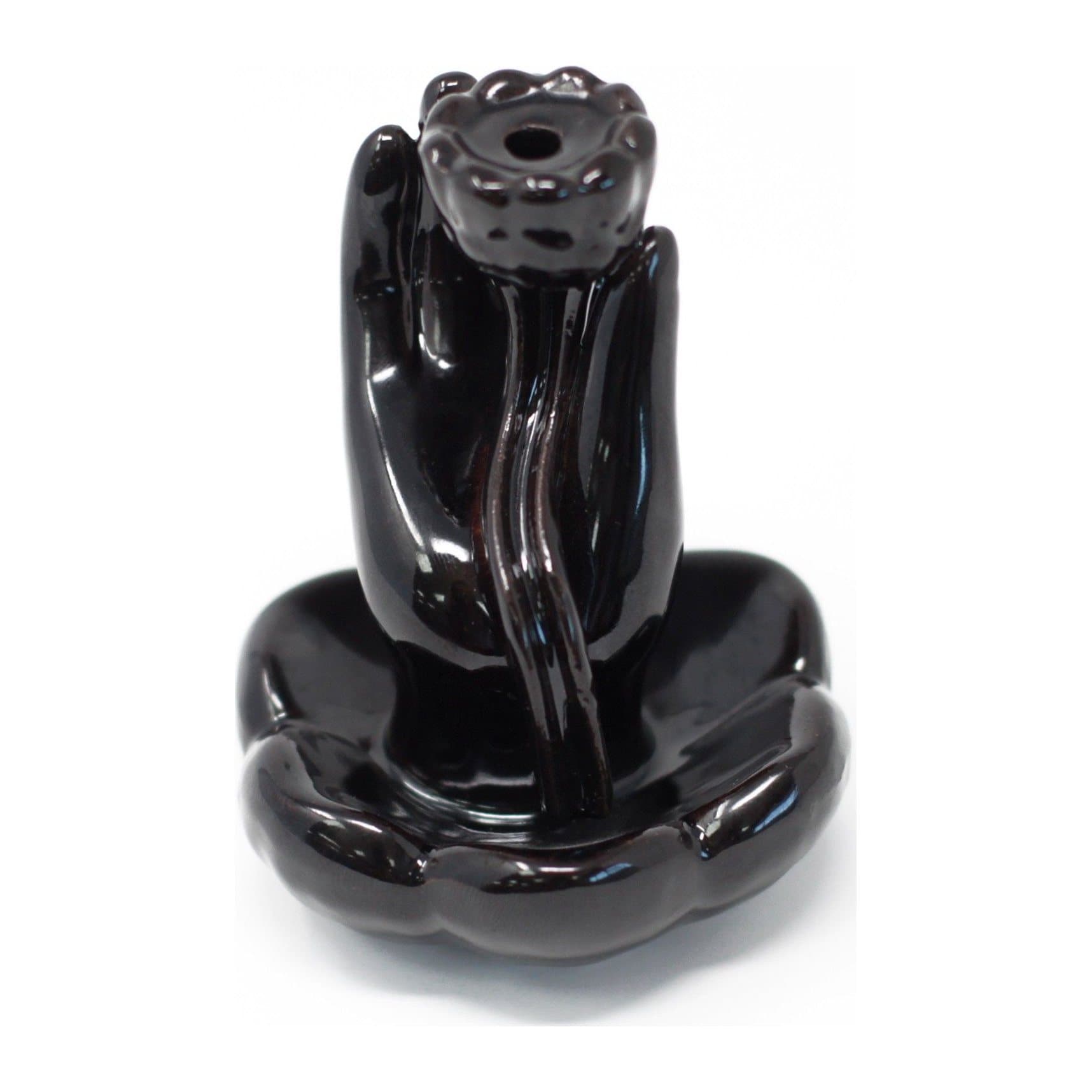 Ceramic backflow incense burner in a hand and lotus flower design
