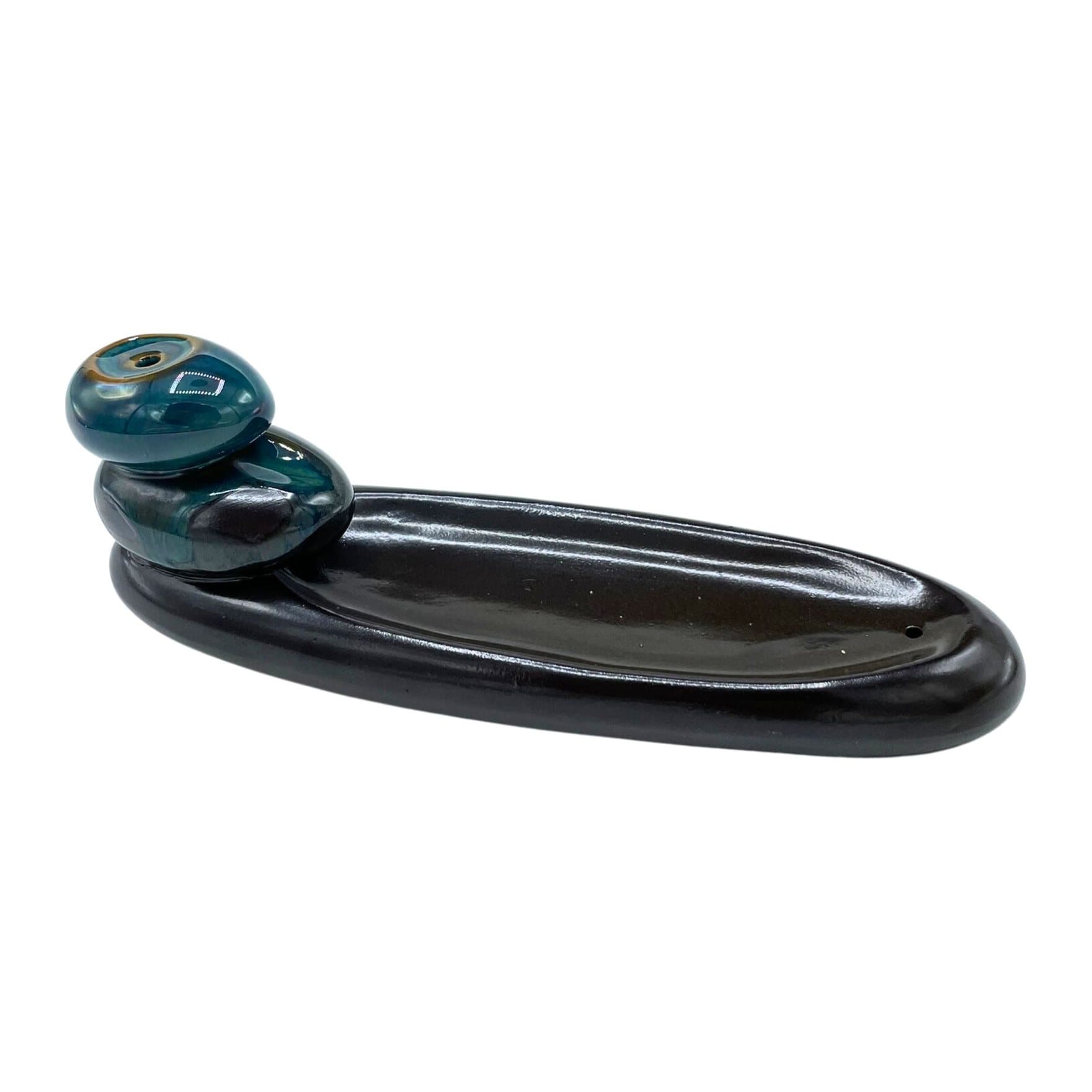 Ceramic Zen pebbles backflow incense burner with smoke flowing downward