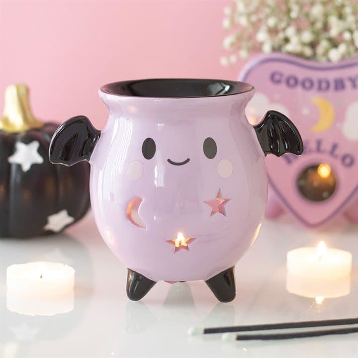 Pastel ceramic cauldron oil burner with bat wings and moon and star cut-outs