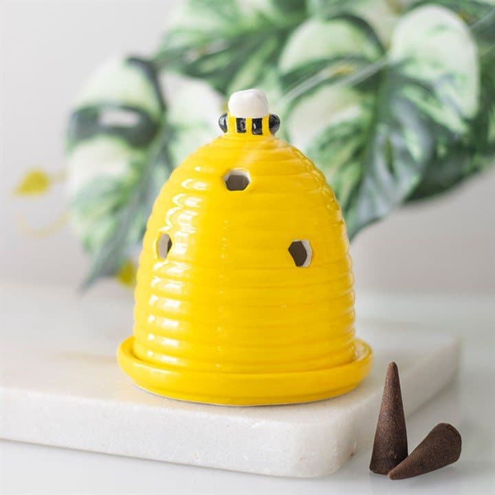 Ceramic beehive incense cone holder topped with a small bee