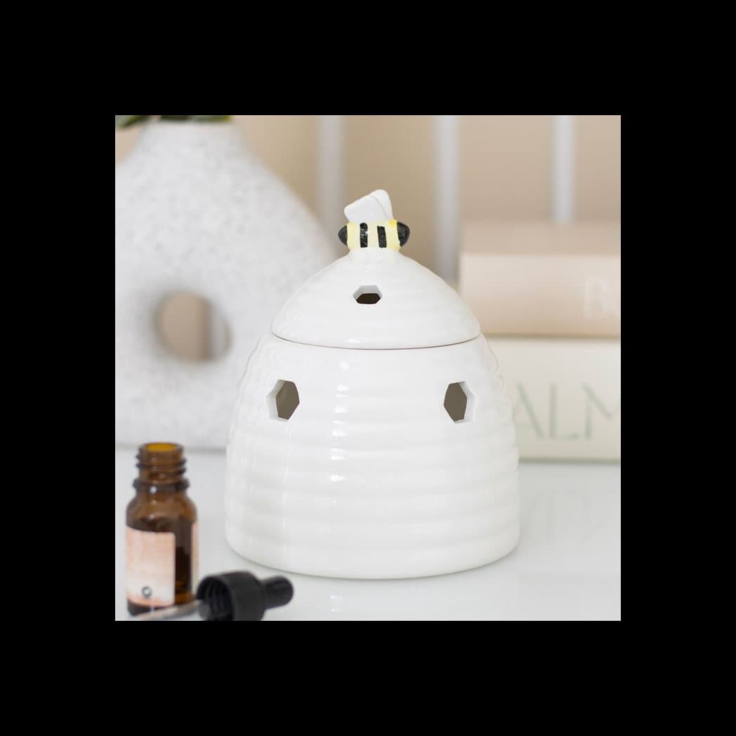 Ceramic beehive oil burner with a bee on the lid