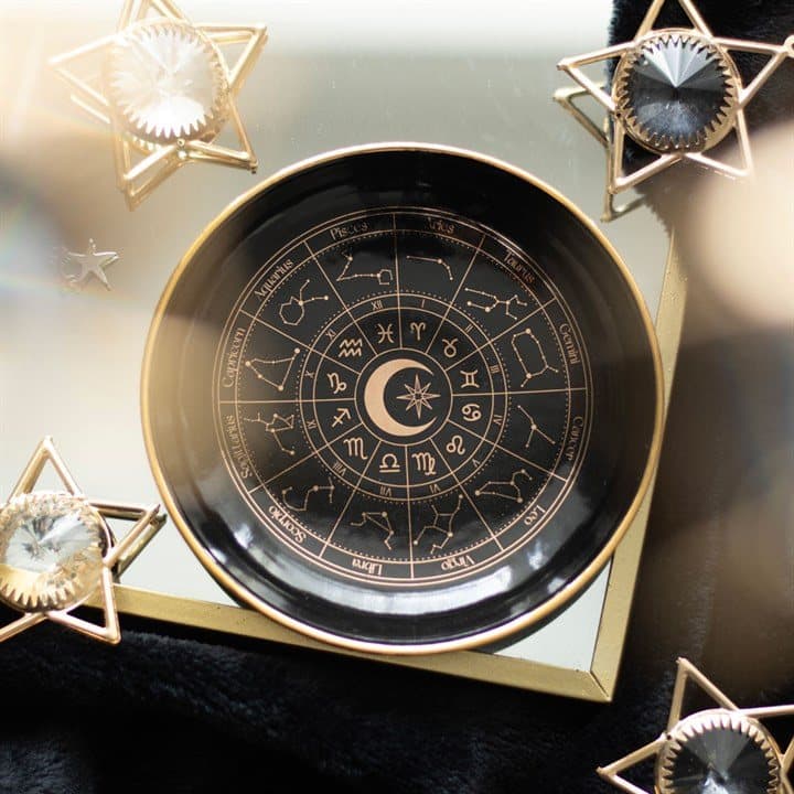 Black ceramic trinket dish with a gold effect astrology wheel design