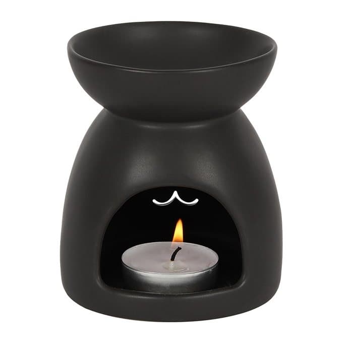 Matt black ceramic oil burner with a cut-out cat face