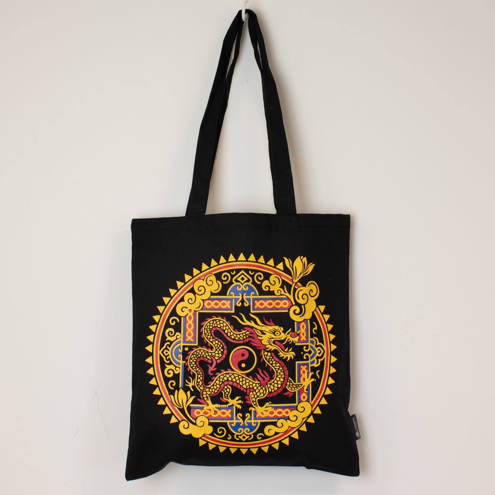 Black cotton tote bag with a dragon and yin yang design
