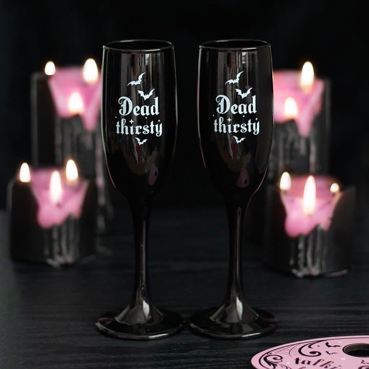 Set of two sleek black Dead Thirsty champagne flutes in a colour cardboard box