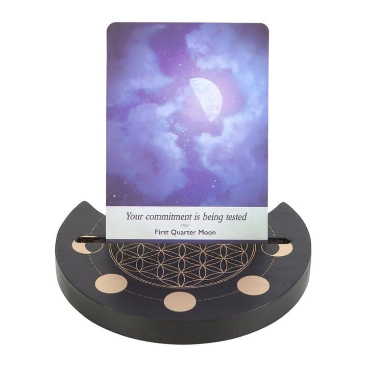 Black wooden tarot card stand with a Flower of Life and crescent moon design
