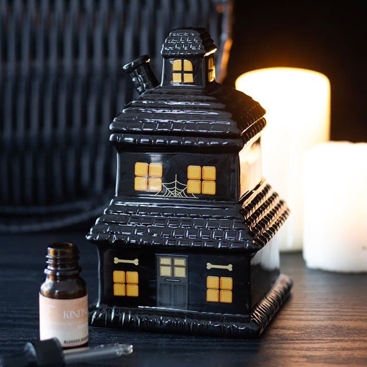 Black ceramic haunted house oil burner and wax warmer