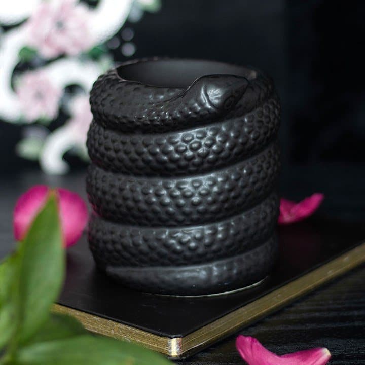 Black ceramic oil burner shaped like a coiled snake