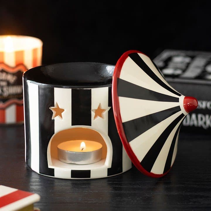 Black striped ceramic oil burner shaped like a twisted circus tent