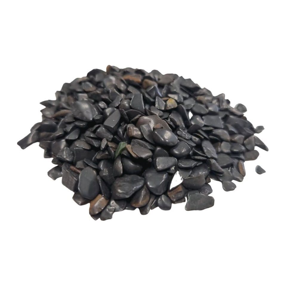 A pile of black tourmaline gemstone chips
