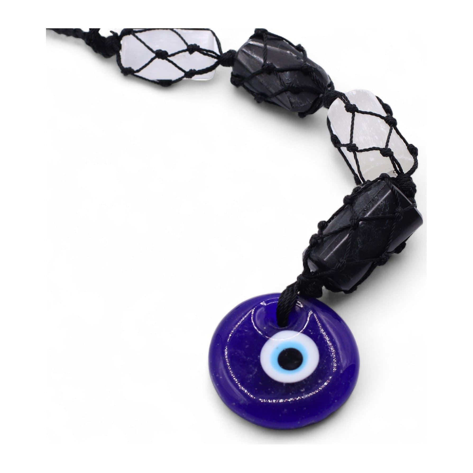 Hanging pendant of black tourmaline and selenite stones with a blue evil eye charm