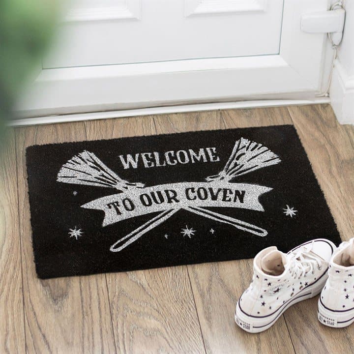 Black coir doormat with silver broomsticks and Welcome to Our Coven text