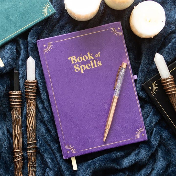 Purple Book of Spells journal with gold detailing and an amethyst crystal pen