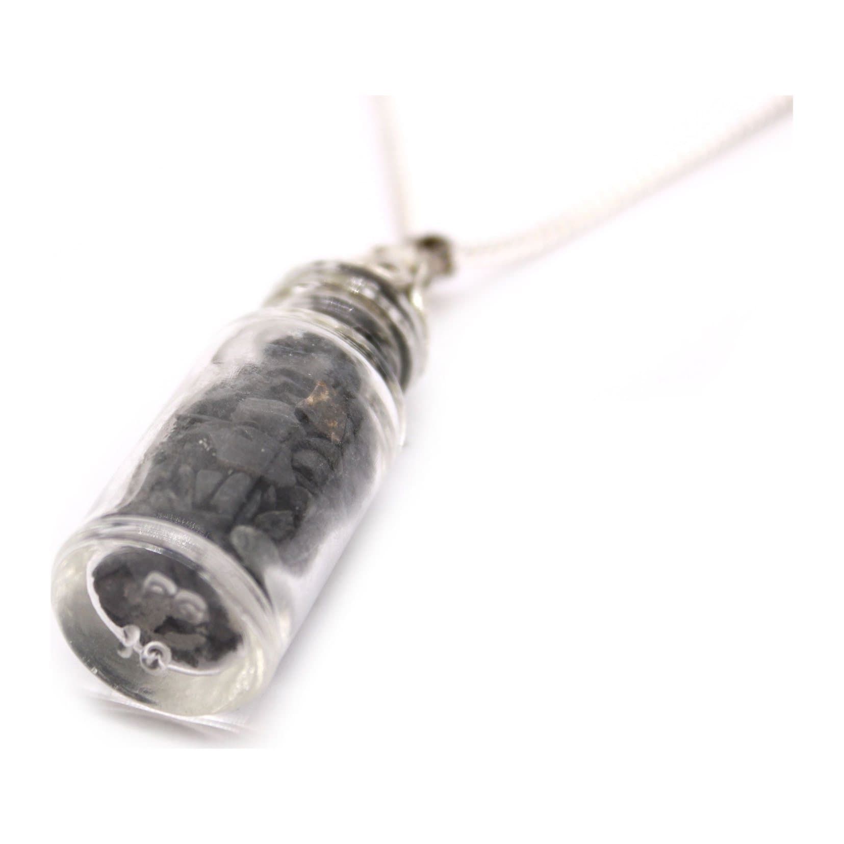 Bottle necklace filled with black onyx stones with a silver plated cap
