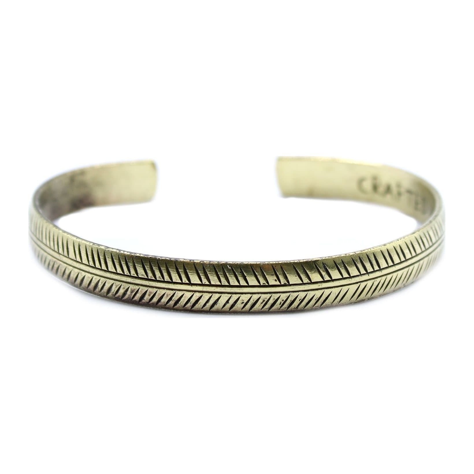 Slim brass Tibetan bracelet with a tribal leaf design
