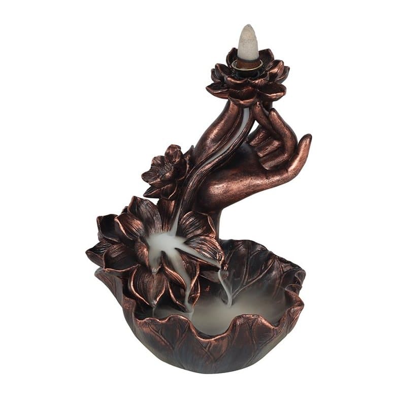Bronze effect hand holding a lotus flower backflow incense burner