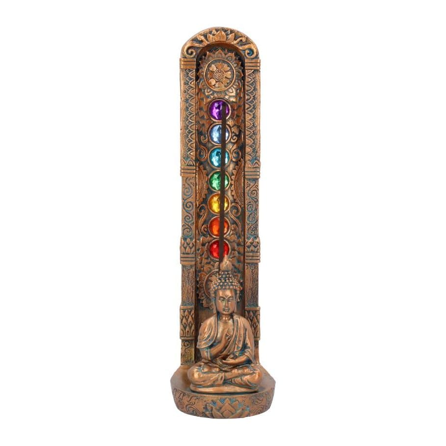 Bronzed Buddha seated in meditation before a back piece set with coloured gems