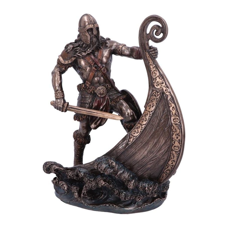 Bronzed resin Viking in a horned helmet holding the figurehead of a longship
