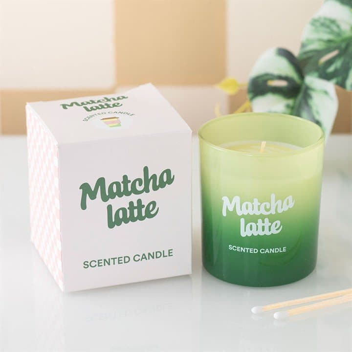 Matcha latte scented candle in a glass jar with its box