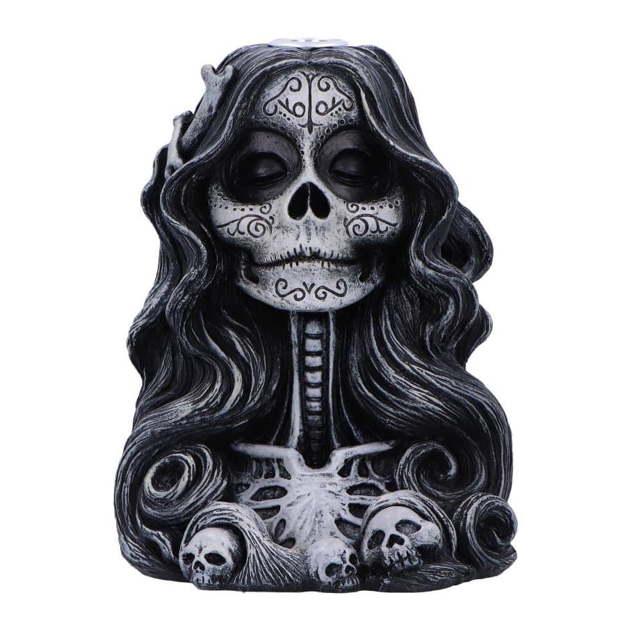 Smiling skeleton backflow incense burner with long black hair and skulls at the base