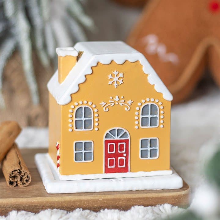 Gingerbread house shaped incense cone holder with a chimney