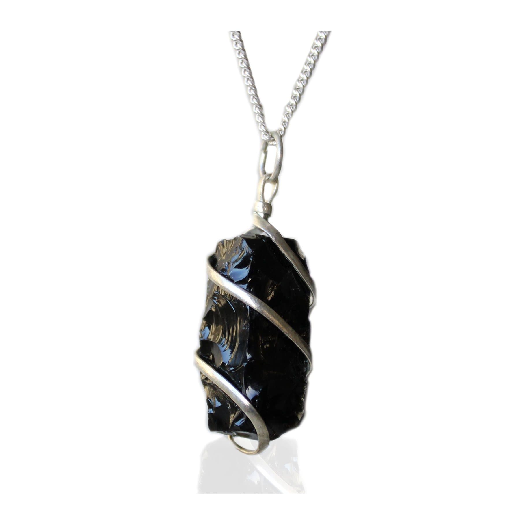 Rough black onyx gemstone pendant on a silver plated chain