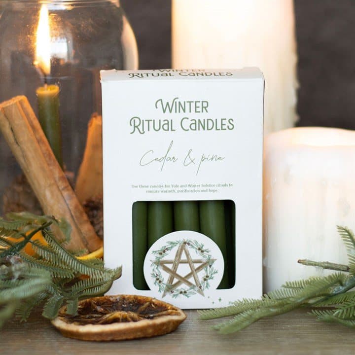 Pack of 12 cedar and pine winter ritual spell candles in a colour cardboard box