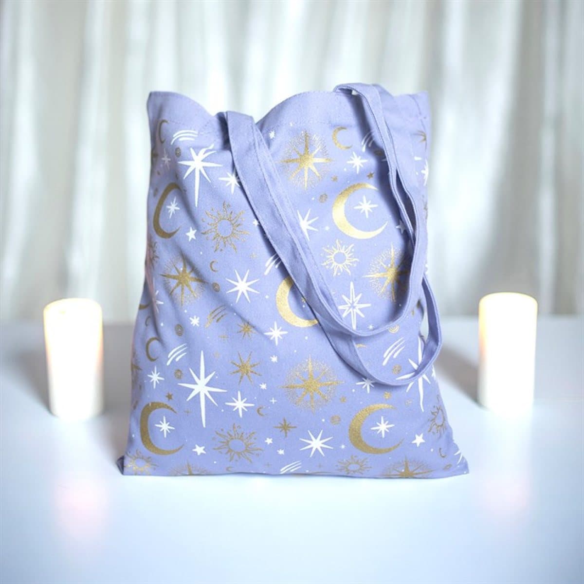 Pastel purple tote bag with crescent moons and stars
