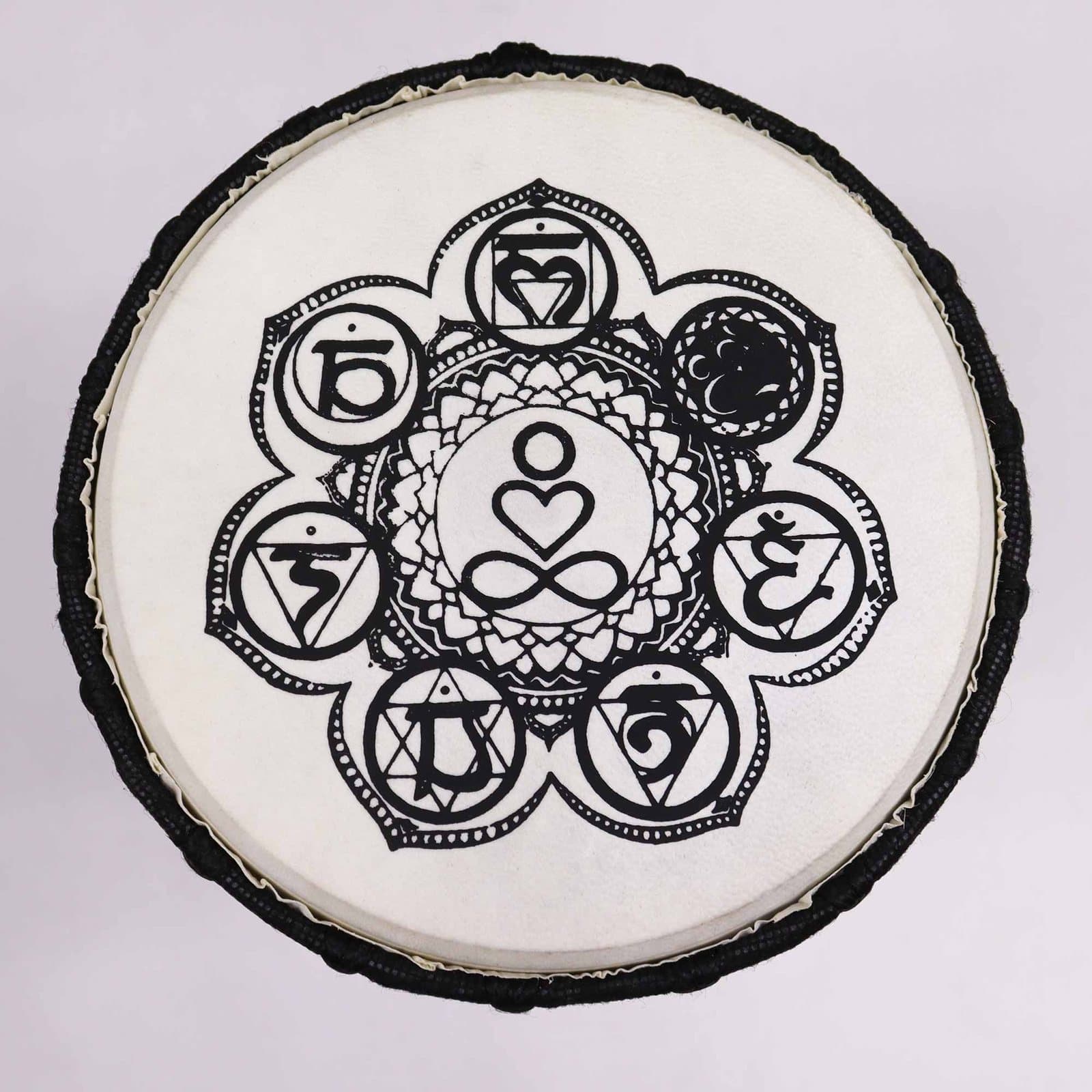 Chakra wide top djembe drum with a chakra design on the head