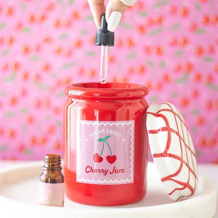 Cherry-red jam jar oil burner with gingham red and white lid