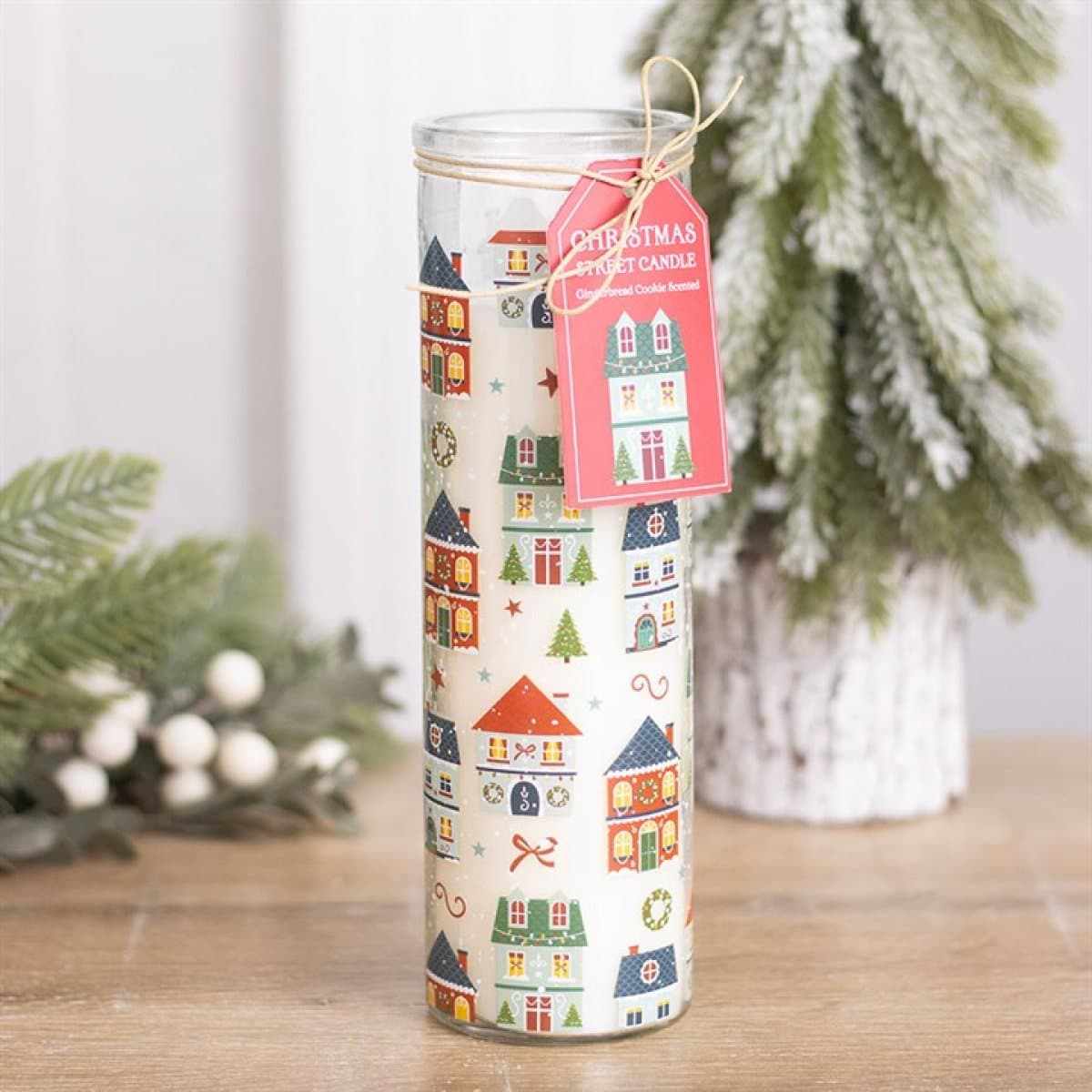 Gingerbread cookie glass tube candle with a Christmas Street village print and tag