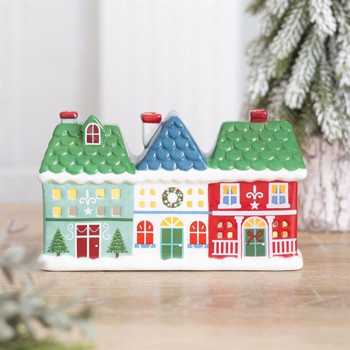 Ceramic holder shaped like three festive houses