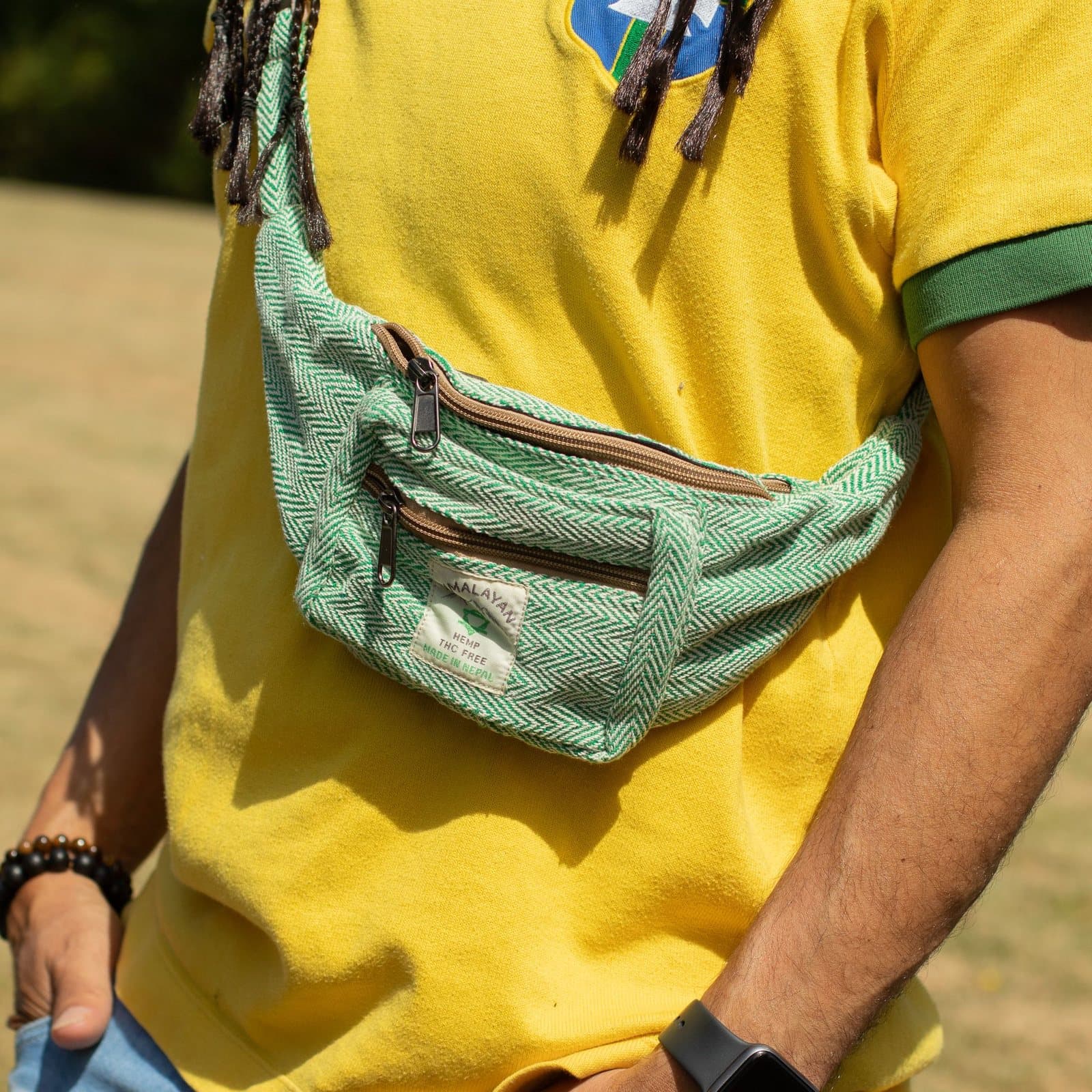 Sage coloured hemp and cotton bags in belt bag and backpack styles