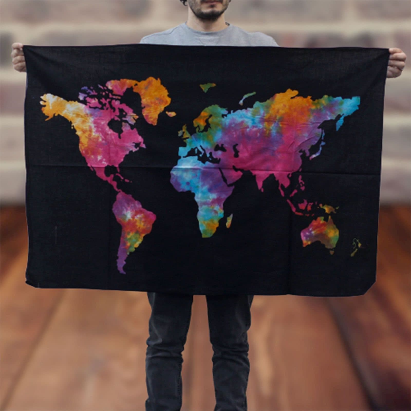 Cotton world map wall hanging with colourful continents on black