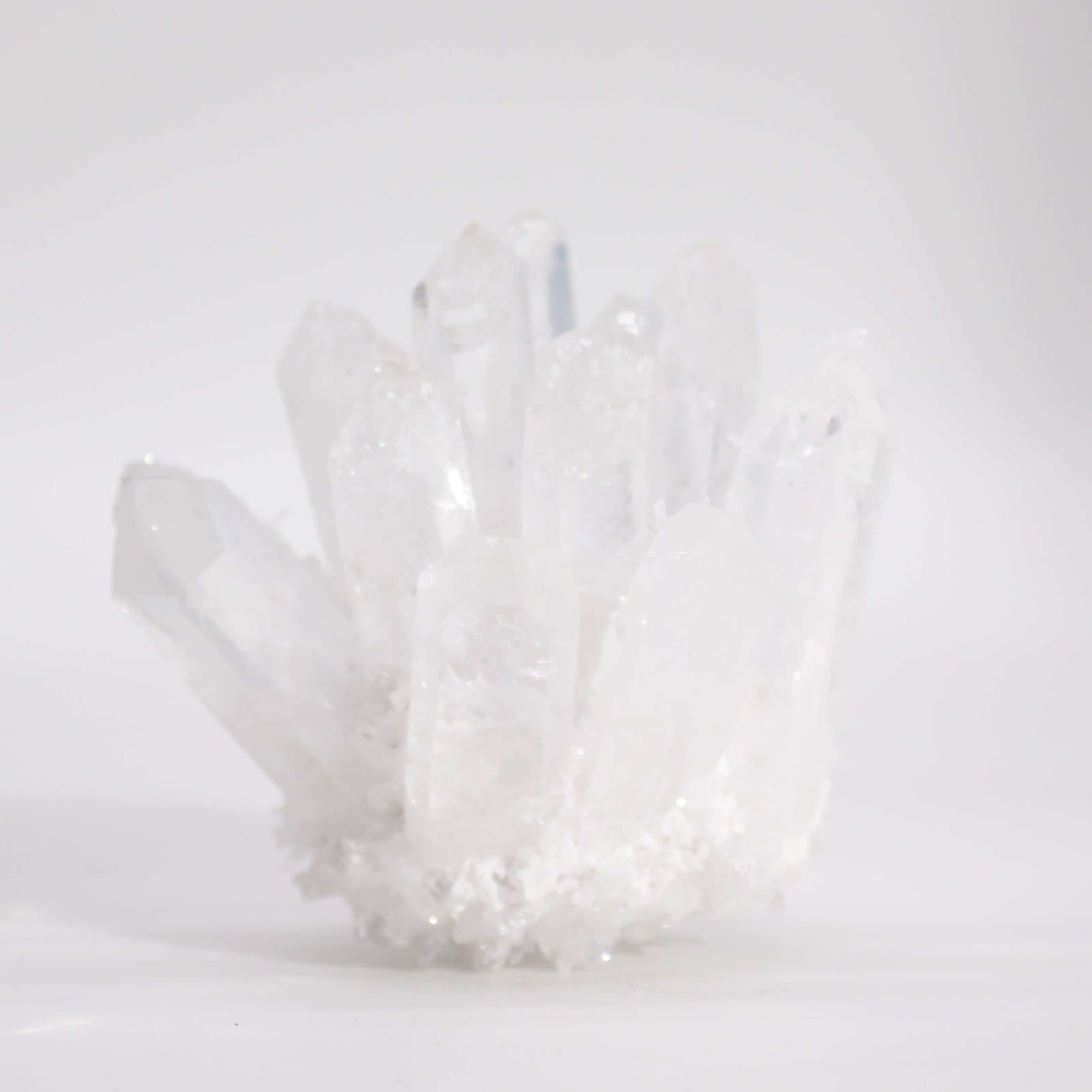 Clear quartz crystal cluster with many points on one base