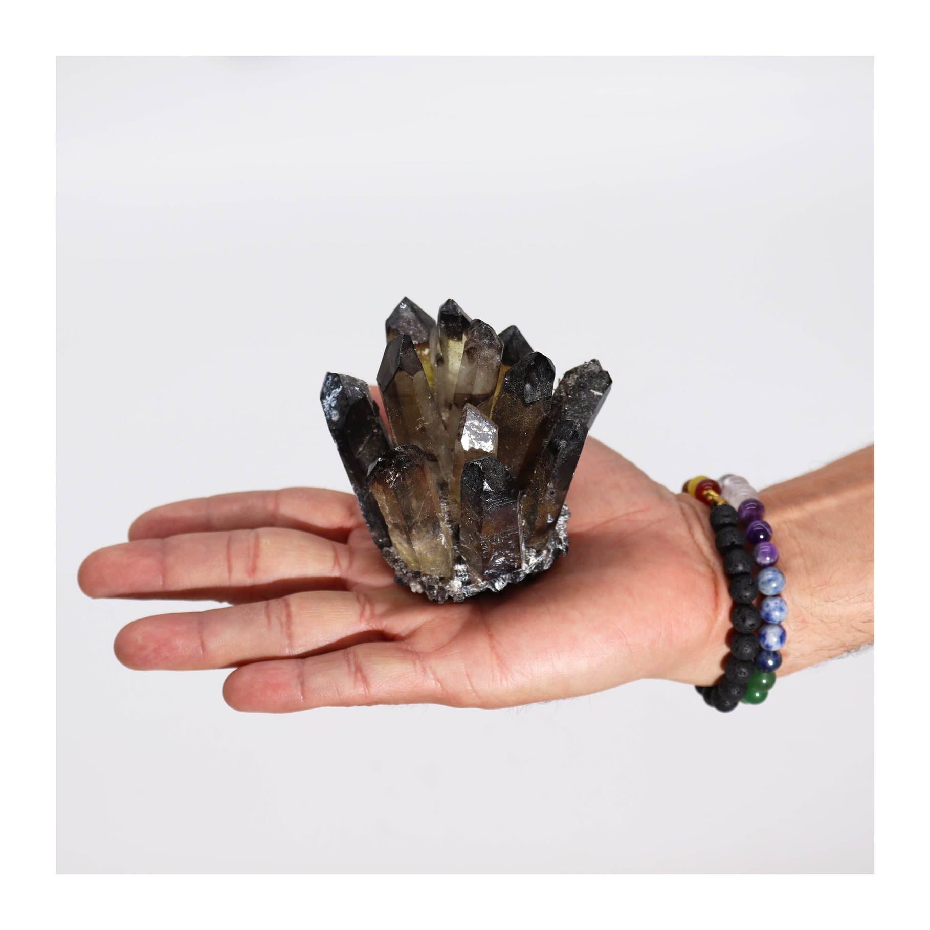Dark smoky quartz cluster with faint ghost-like inclusions